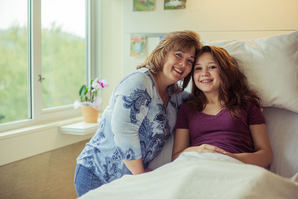 Patient on the bed with a parent