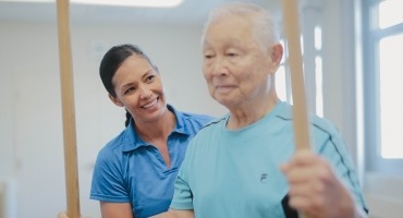 Staff member working with orthopedic rehabilitation patient